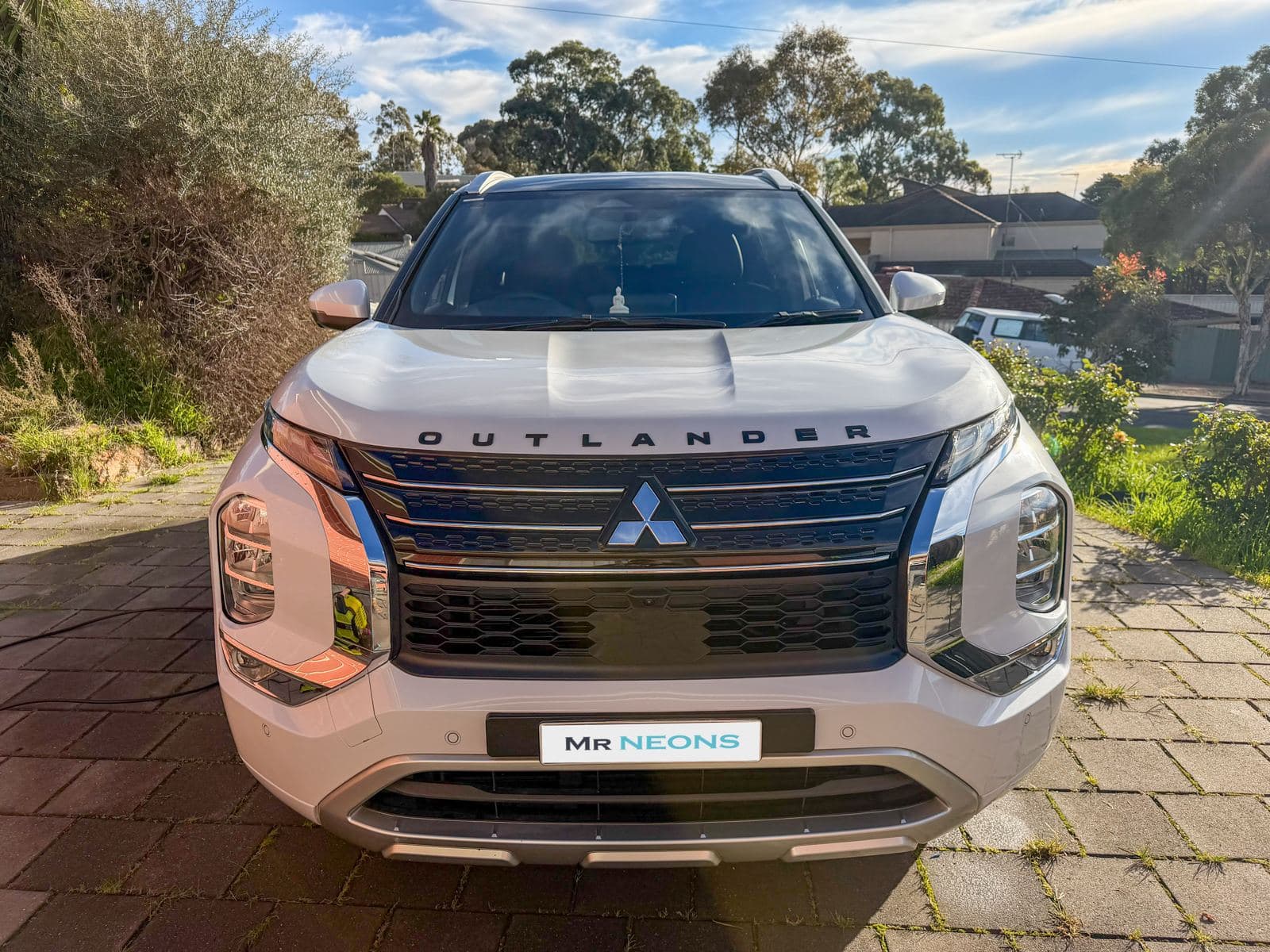 Mitsubishi Outlander detailed by MR NEONS, front view at golden hour