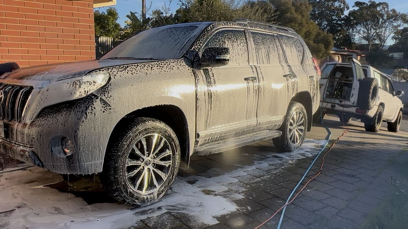 Before: Toyota Prado covered in snow foam during the wash
